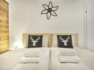 Ein Bett oder Betten in einem Zimmer der Unterkunft Bergliebe