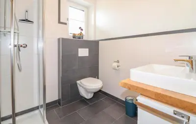 Ein Badezimmer in der Unterkunft Ferienwohnung 45M2