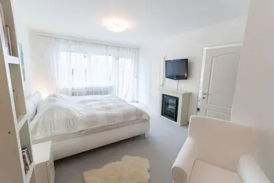Ein Bett oder Betten in einem Zimmer der Unterkunft Modern Living Traditional Style