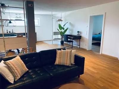 Ein Sitzbereich in der Unterkunft Tolle Wohnung mit Seeblick