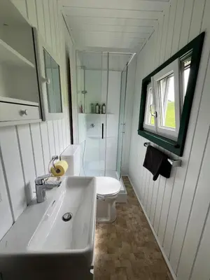 Ein Badezimmer in der Unterkunft HIASN Haus