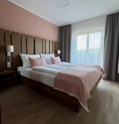 Ein Bett oder Betten in einem Zimmer der Unterkunft Apartmenthotel 's Mitterndorf
