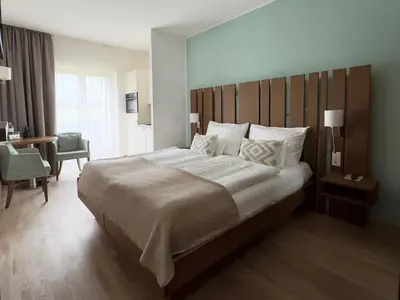 Ein Bett oder Betten in einem Zimmer der Unterkunft Apartmenthotel 's Mitterndorf