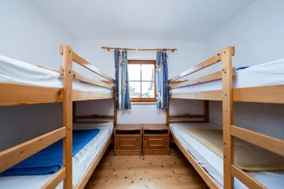 Ein Bett oder Betten in einem Zimmer der Unterkunft Chalets am Feuerkogel by Landluft