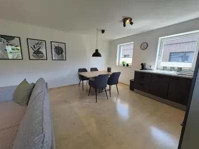 Ein Sitzbereich in der Unterkunft Apartment East