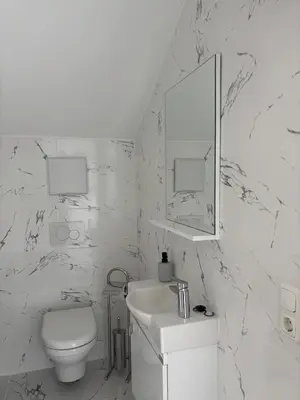Ein Badezimmer in der Unterkunft SC Apartments Bad Goisern - contactless check in
