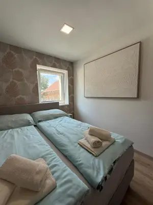 Ein Bett oder Betten in einem Zimmer der Unterkunft SUNSET RESIDENCE Attersee