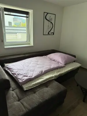 Ein Bett oder Betten in einem Zimmer der Unterkunft SUNSET RESIDENCE Attersee