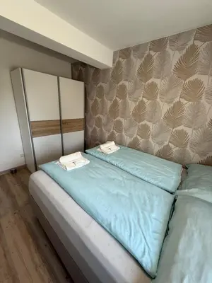 Ein Bett oder Betten in einem Zimmer der Unterkunft SUNSET RESIDENCE Attersee