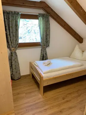 Ein Bett oder Betten in einem Zimmer der Unterkunft Riegleralm