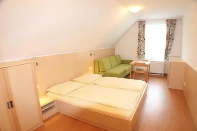 Ein Bett oder Betten in einem Zimmer der Unterkunft Jugendgästehaus St. Gilgen