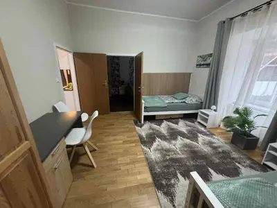 Ein Bett oder Betten in einem Zimmer der Unterkunft Park apartman Kertes ház a park mellett gyönyörű kilátással Dog friendly garden house with a wonderful view next to the park