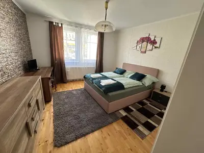 Ein Bett oder Betten in einem Zimmer der Unterkunft Park apartman Kertes ház a park mellett gyönyörű kilátással Dog friendly garden house with a wonderful view next to the park