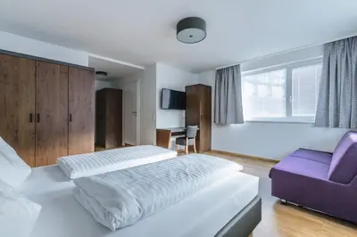 Ein Bett oder Betten in einem Zimmer der Unterkunft Haus Hubertus by Summit Travel
