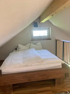 Ein Bett oder Betten in einem Zimmer der Unterkunft Ferienwohnung Mondsee-Irrsee