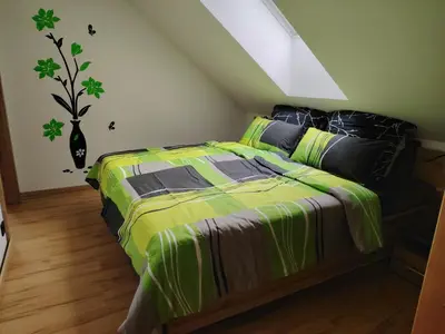 Ein Bett oder Betten in einem Zimmer der Unterkunft Suite Orchidee - SalzkammerNest