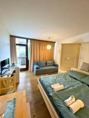 Ein Bett oder Betten in einem Zimmer der Unterkunft Ridge & Hide Bad Goisern