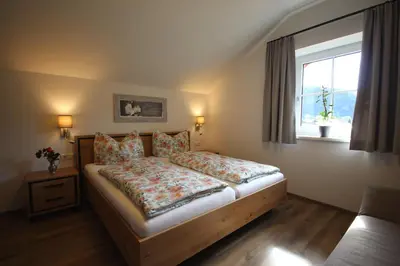 Ein Bett oder Betten in einem Zimmer der Unterkunft Ferienwohnung Schlossmayr