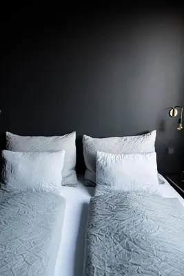 Ein Bett oder Betten in einem Zimmer der Unterkunft haus und hof - Design Apartments im Salzkammergut