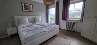 Ein Bett oder Betten in einem Zimmer der Unterkunft Ferienwohnung Haus Lisa