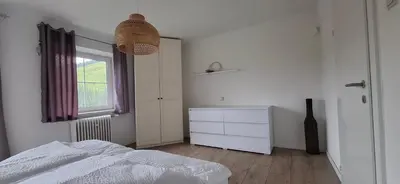 Ein Bett oder Betten in einem Zimmer der Unterkunft Ferienwohnung Haus Lisa