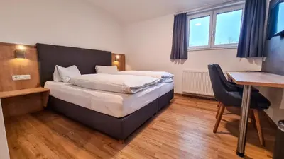 Ein Bett oder Betten in einem Zimmer der Unterkunft Gasthof Weissl