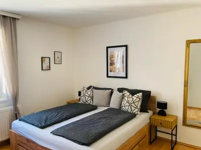 Ein Bett oder Betten in einem Zimmer der Unterkunft Apartment beim Schloss Ort mit Balkon und Parkplatz