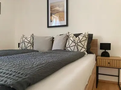 Ein Bett oder Betten in einem Zimmer der Unterkunft Apartment beim Schloss Ort mit Balkon und Parkplatz