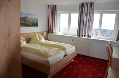 Ein Bett oder Betten in einem Zimmer der Unterkunft Gasthof-Pension Urzn