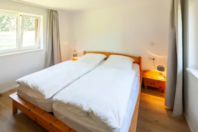 Ein Bett oder Betten in einem Zimmer der Unterkunft Familienfreundliches Chalet mit Sauna & Kamin 5 Minuten zum Skigebiet