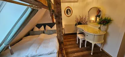 Ein Bett oder Betten in einem Zimmer der Unterkunft Sisi's Loft - Suite Royale