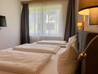 Ein Bett oder Betten in einem Zimmer der Unterkunft Winzerchalet