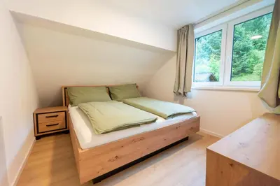 Ein Bett oder Betten in einem Zimmer der Unterkunft Ferienwohnungen Traunblick & Salzweg