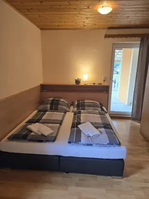 Ein Bett oder Betten in einem Zimmer der Unterkunft Goisernblick - Apartments bei Hallstatt
