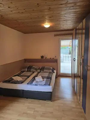 Ein Bett oder Betten in einem Zimmer der Unterkunft Goisernblick - Apartments bei Hallstatt