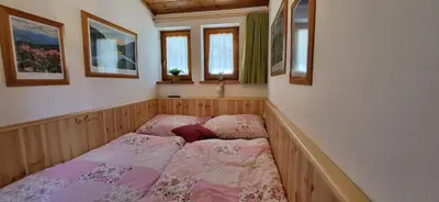 Ein Bett oder Betten in einem Zimmer der Unterkunft Planaiblick by Alpenidyll Apartments