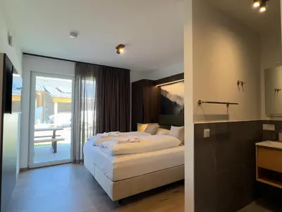 Ein Bett oder Betten in einem Zimmer der Unterkunft Gipfelglück