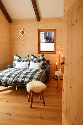 Ein Bett oder Betten in einem Zimmer der Unterkunft Chalet Gipfelsturm