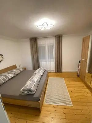 Ein Bett oder Betten in einem Zimmer der Unterkunft Ferienwohnung Linner