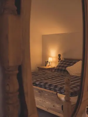 Ein Bett oder Betten in einem Zimmer der Unterkunft Postwirt Annaberg