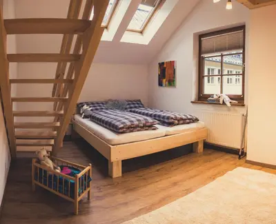 Ein Bett oder Betten in einem Zimmer der Unterkunft Postwirt Annaberg