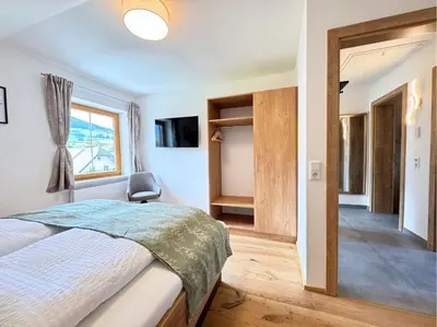 Ein Bett oder Betten in einem Zimmer der Unterkunft Meri Appartements im Lungau nahe Obertauern - öffentliche Verkehrsmittel gratis