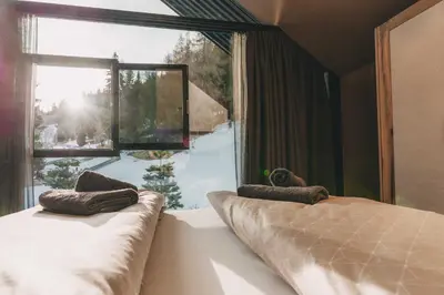 Ein Bett oder Betten in einem Zimmer der Unterkunft Hüttendorf Schlögelberger