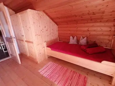 Ein Bett oder Betten in einem Zimmer der Unterkunft Ferienwohnung am Bauernhof Koa