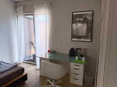 Ein Sitzbereich in der Unterkunft Guest room with private shower and toilet near Salzburg City