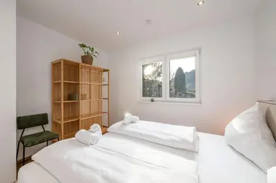 Ein Bett oder Betten in einem Zimmer der Unterkunft Drei Berge Blick - by myNests