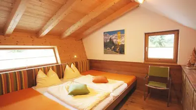 Ein Bett oder Betten in einem Zimmer der Unterkunft Alpin Chalet Filzmoos