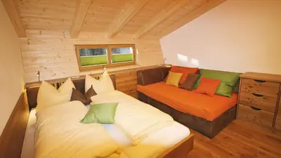 Ein Bett oder Betten in einem Zimmer der Unterkunft Alpin Chalet Filzmoos