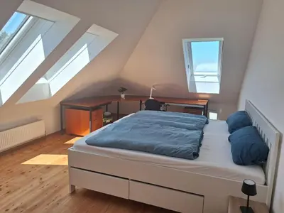 Ein Bett oder Betten in einem Zimmer der Unterkunft Ferienwohnung Kampesberg