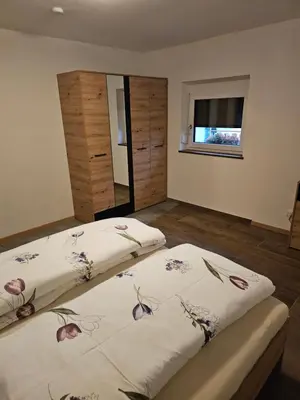 Ein Bett oder Betten in einem Zimmer der Unterkunft Ferienwohnungen Kübler